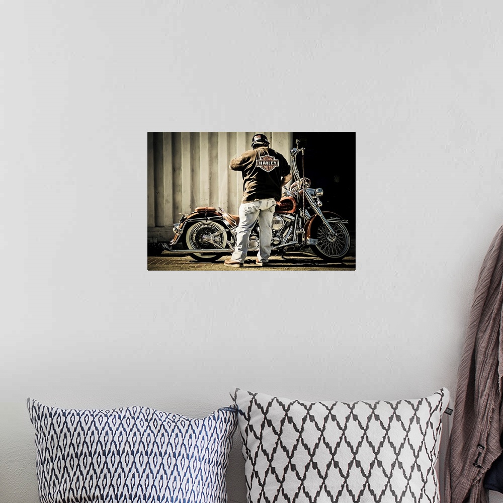 A bohemian room featuring Biker with his motorcycle