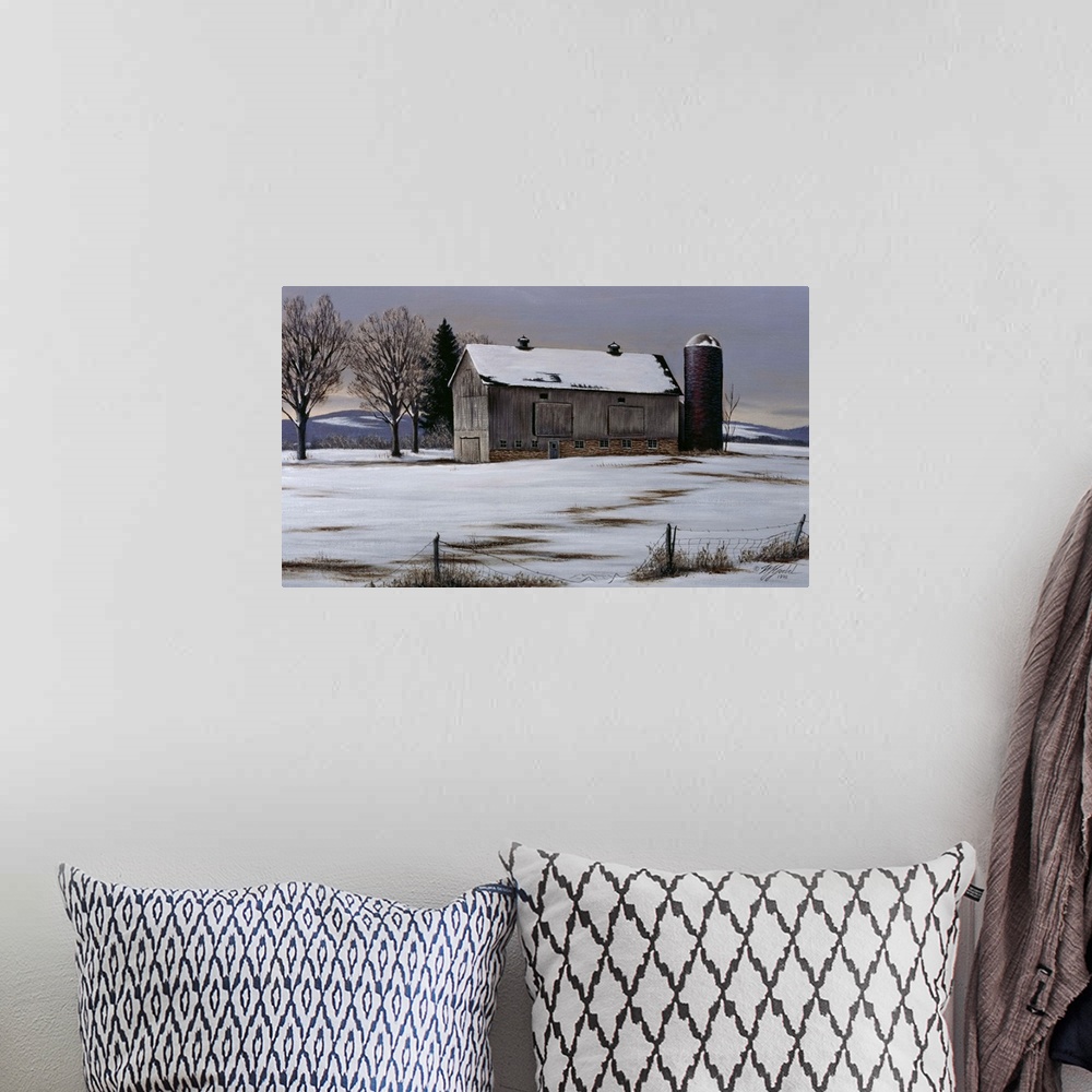 A bohemian room featuring An old barn and silo in a meadow with snow on the ground.