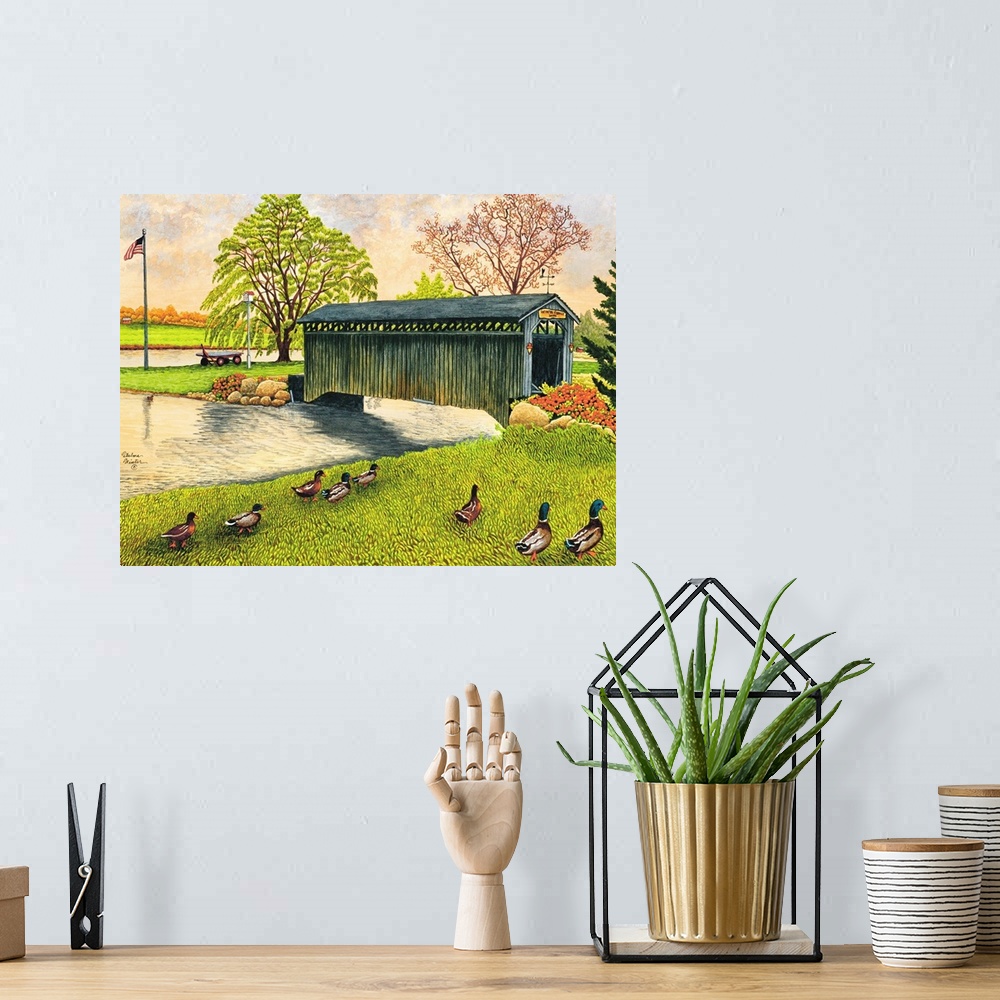 A bohemian room featuring Contemporary artwork of a covered bridge spanning a small river New York.