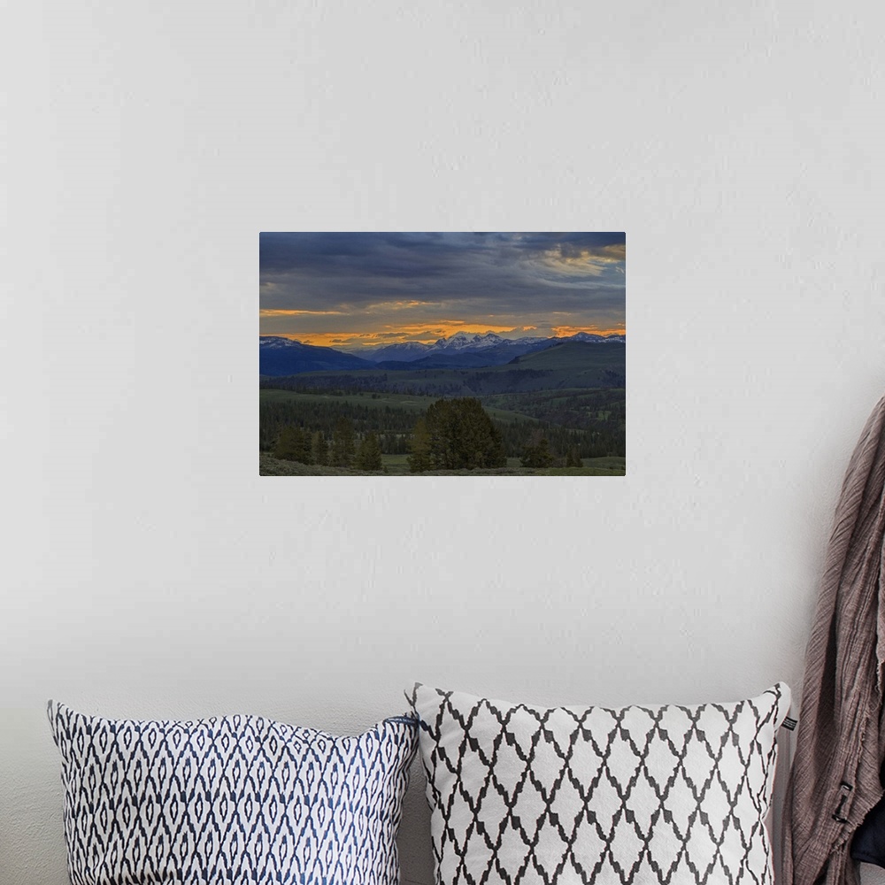 A bohemian room featuring Photograph of the Yellowstone national park scenery at sunrise.