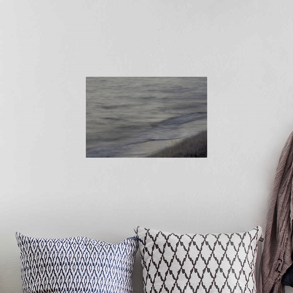 A bohemian room featuring Impressionist photograph of a beach walk.