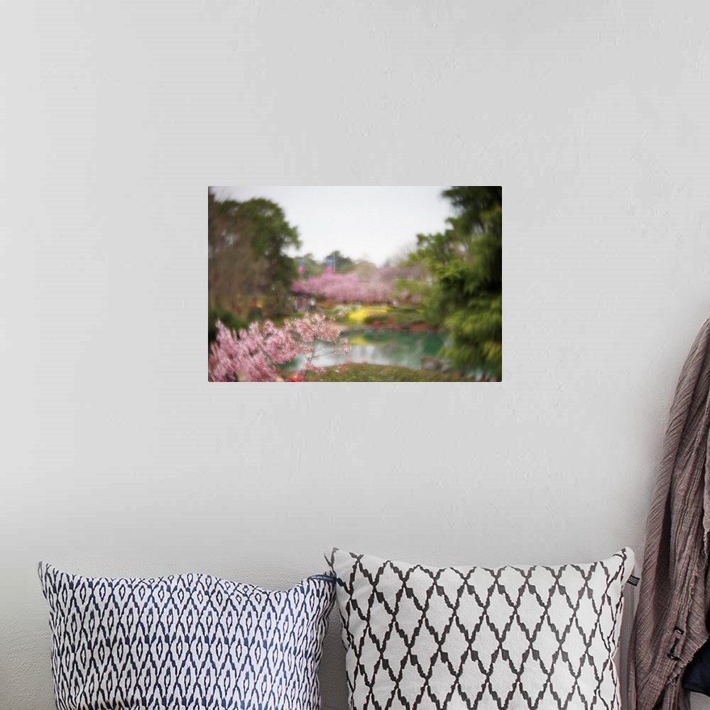 A bohemian room featuring Dreamy photograph that captures the ambience of a cherry blossom garden.