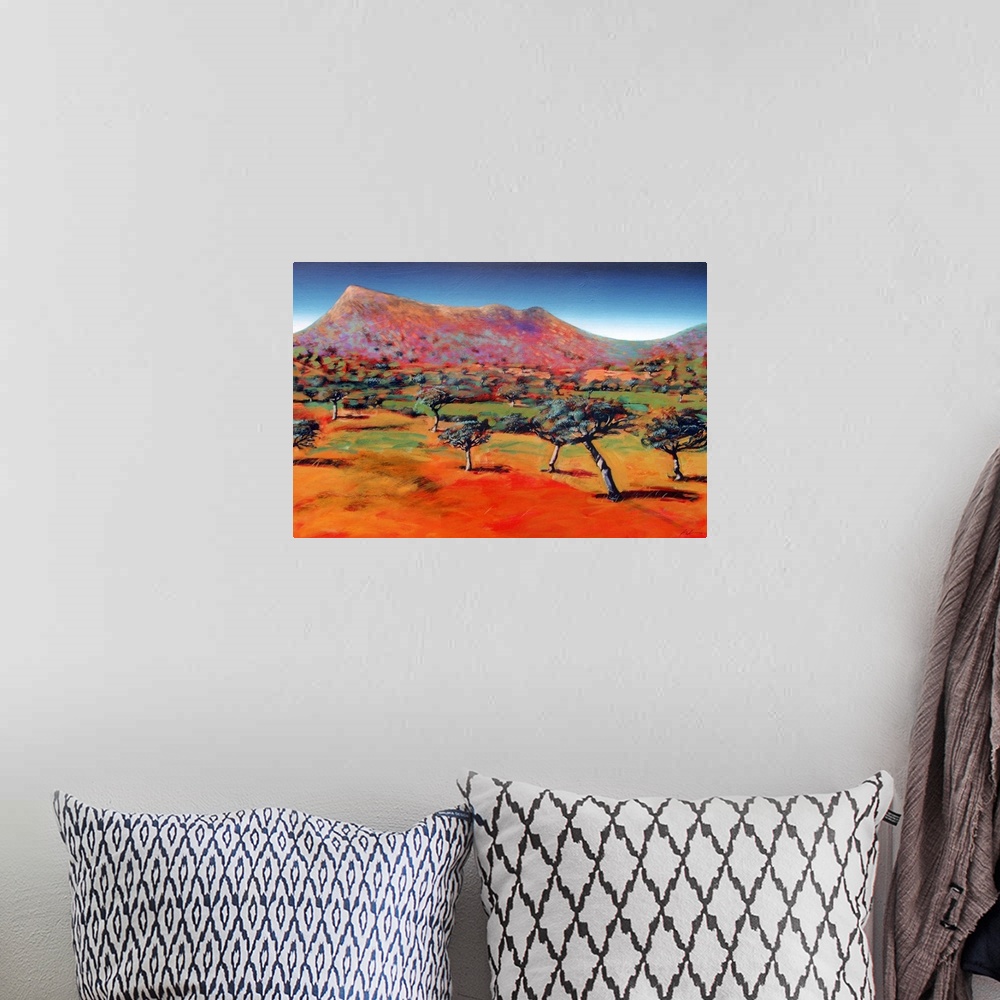 A bohemian room featuring Acrylic painting of trees randomly sticking up on the flat ground at the base of a barren mountain.