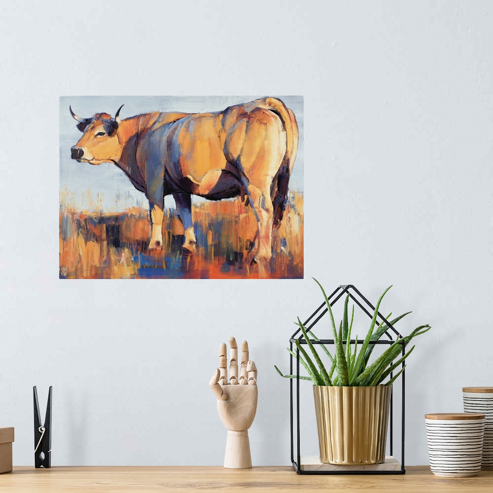 A bohemian room featuring Contemporary painting of a large cow in a field in harsh sunlight.