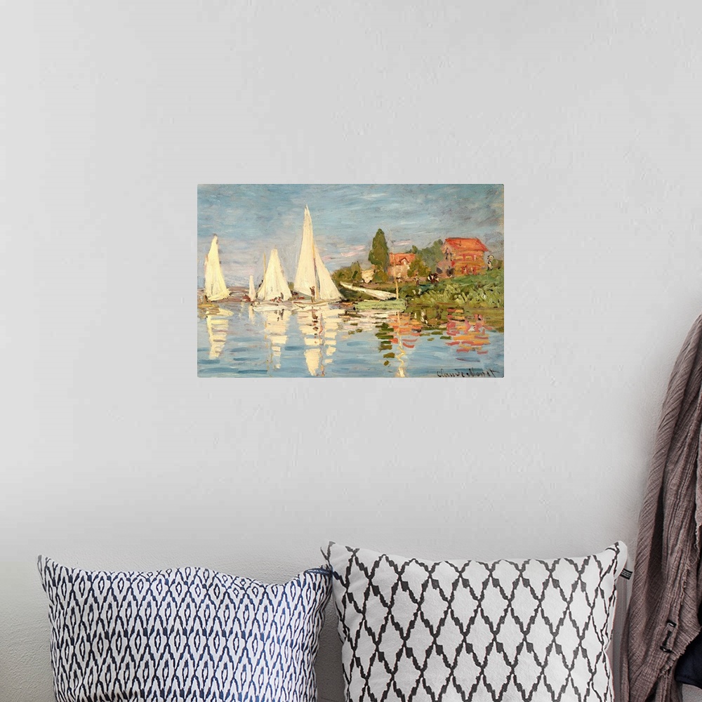 A bohemian room featuring Classic painting of sail boats just off the shore in the water.  The shore is lined with trees an...