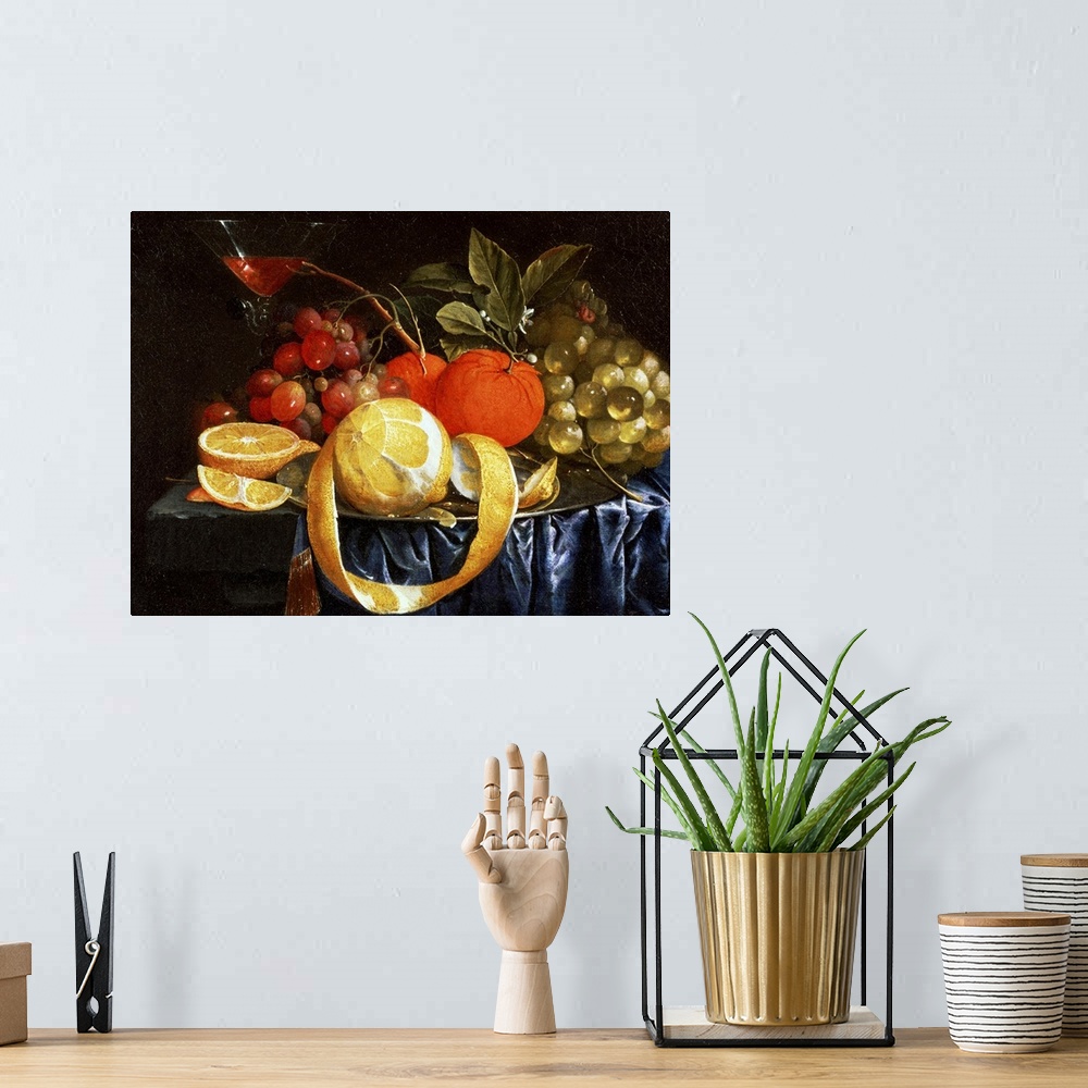 A bohemian room featuring Classic artwork of different types of fruit sitting in a pile on a table with a martini glass pla...