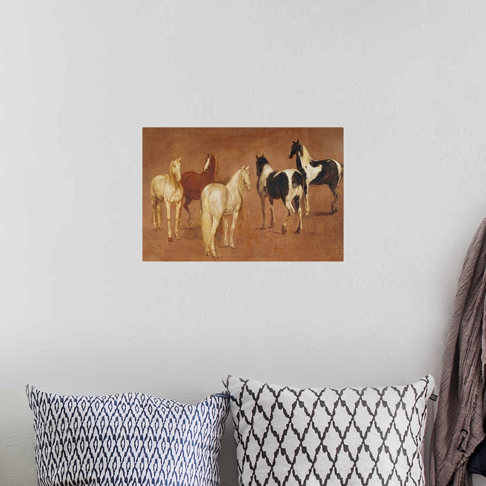 A bohemian room featuring An oil painting of five horses in various positions and coloring.