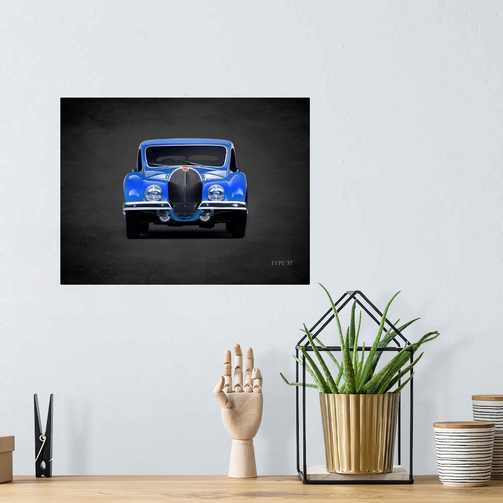 A bohemian room featuring Photograph of a blue 1936 Bugatti Type-57 printed on a black background with a dark vignette.