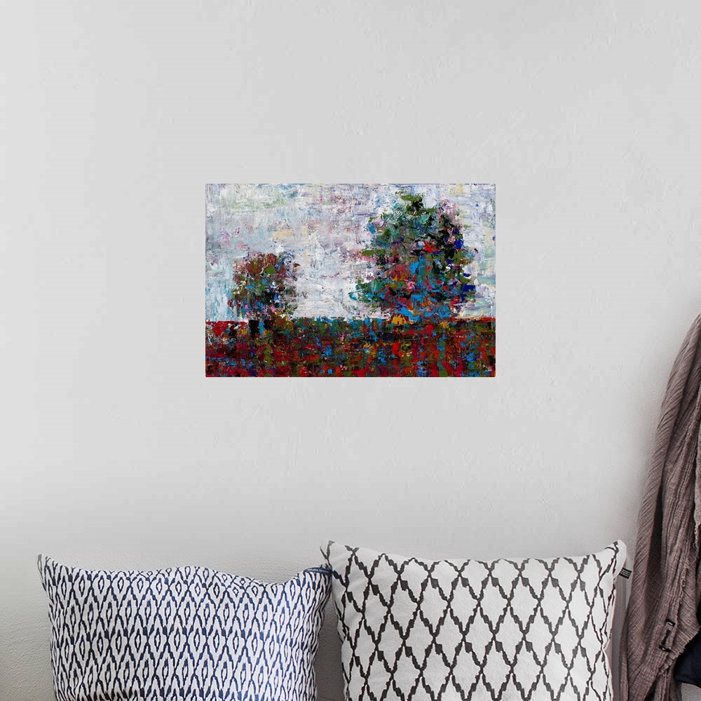 A bohemian room featuring Abstract landscape with two trees created with many colors and small, layered brushstrokes.