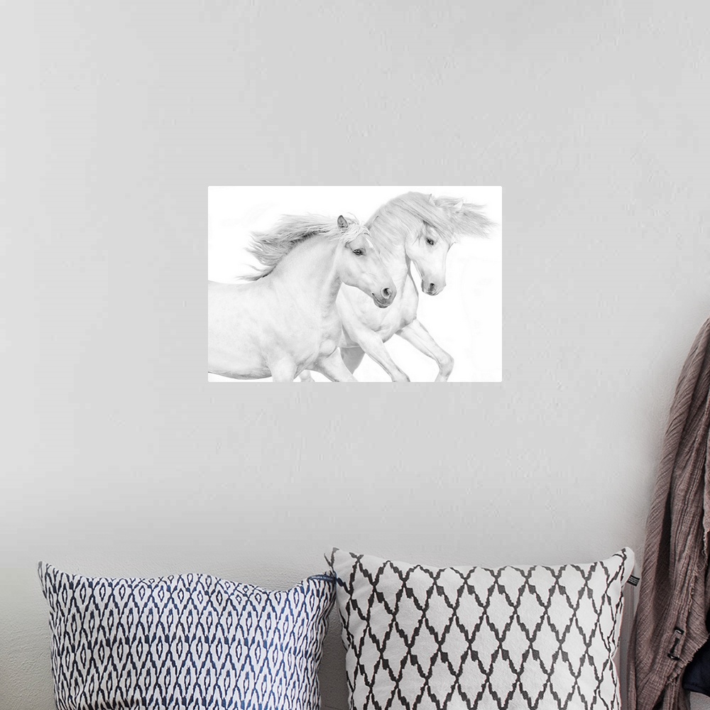 A bohemian room featuring Photograph of galloping white horses against a white background.