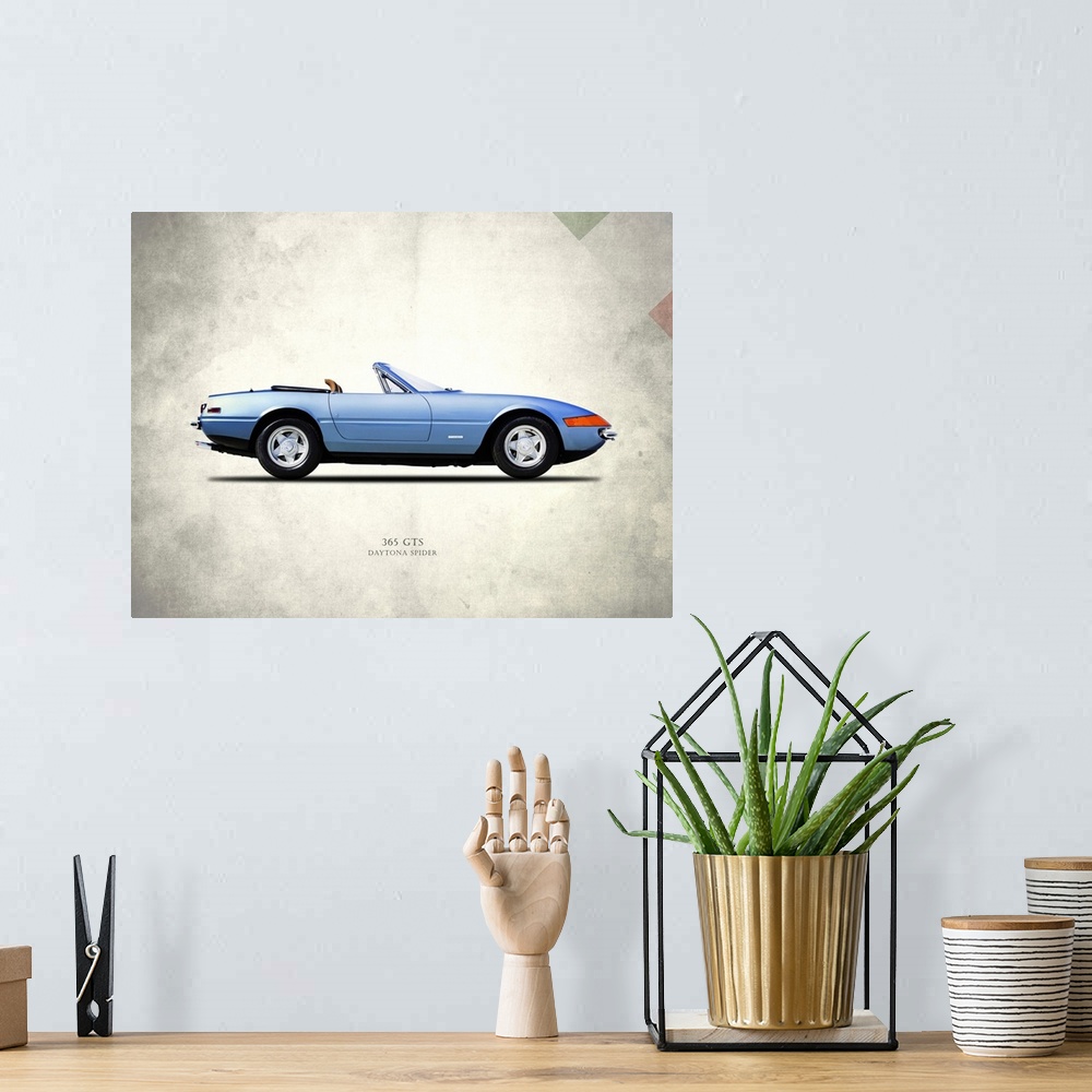 A bohemian room featuring Photograph of a blue Ferrari 365GTS Daytona Spider printed on a distressed white and gray backgro...