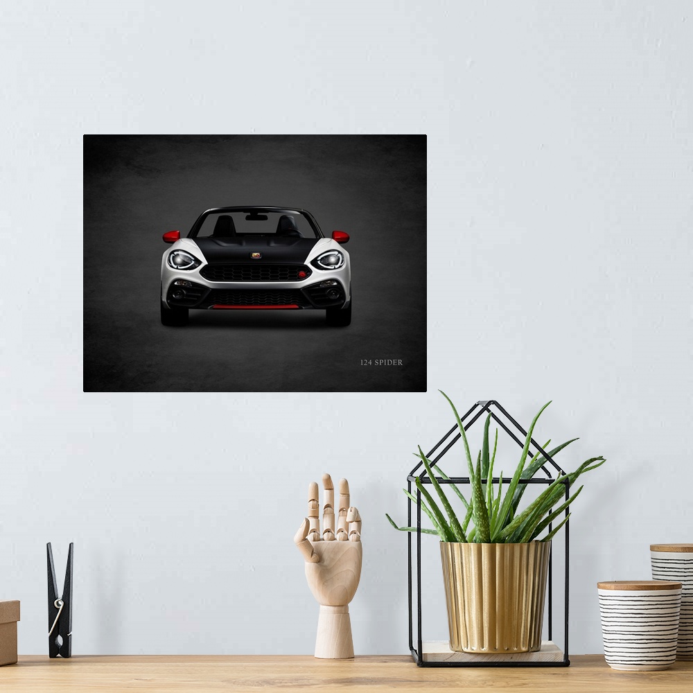 A bohemian room featuring Photograph of a silver, black, and red Fiat 124 Spider printed on a black background with a dark ...