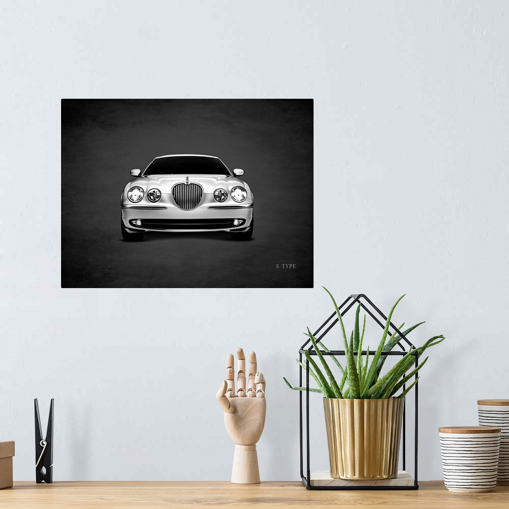 A bohemian room featuring Photograph of a silver Jaguar S-Type printed on a black background with a dark vignette.