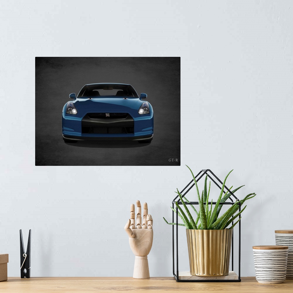 A bohemian room featuring Photograph of a blue Niassn GT-R printed on a black background with a dark vignette.