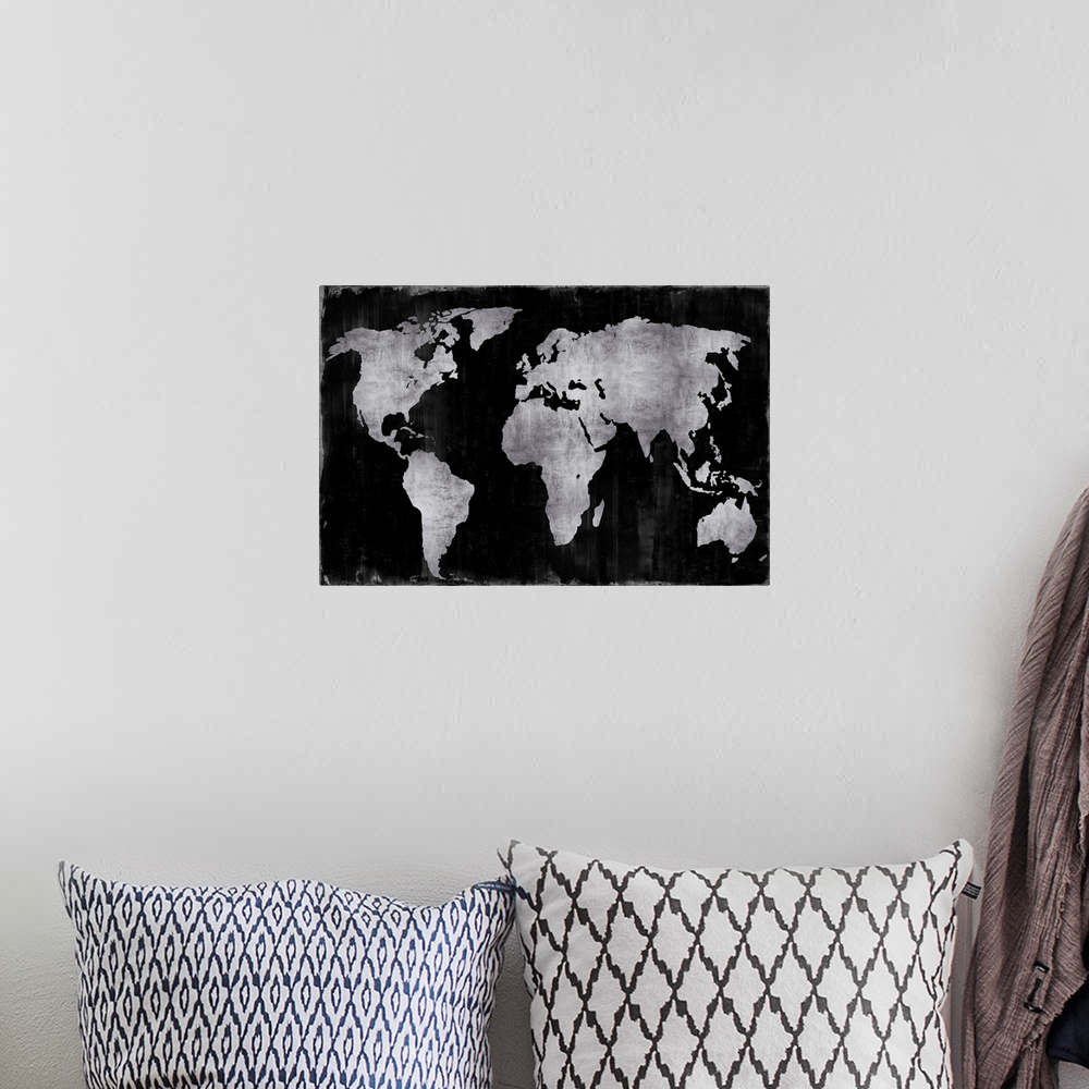 A bohemian room featuring World map in silver and black.