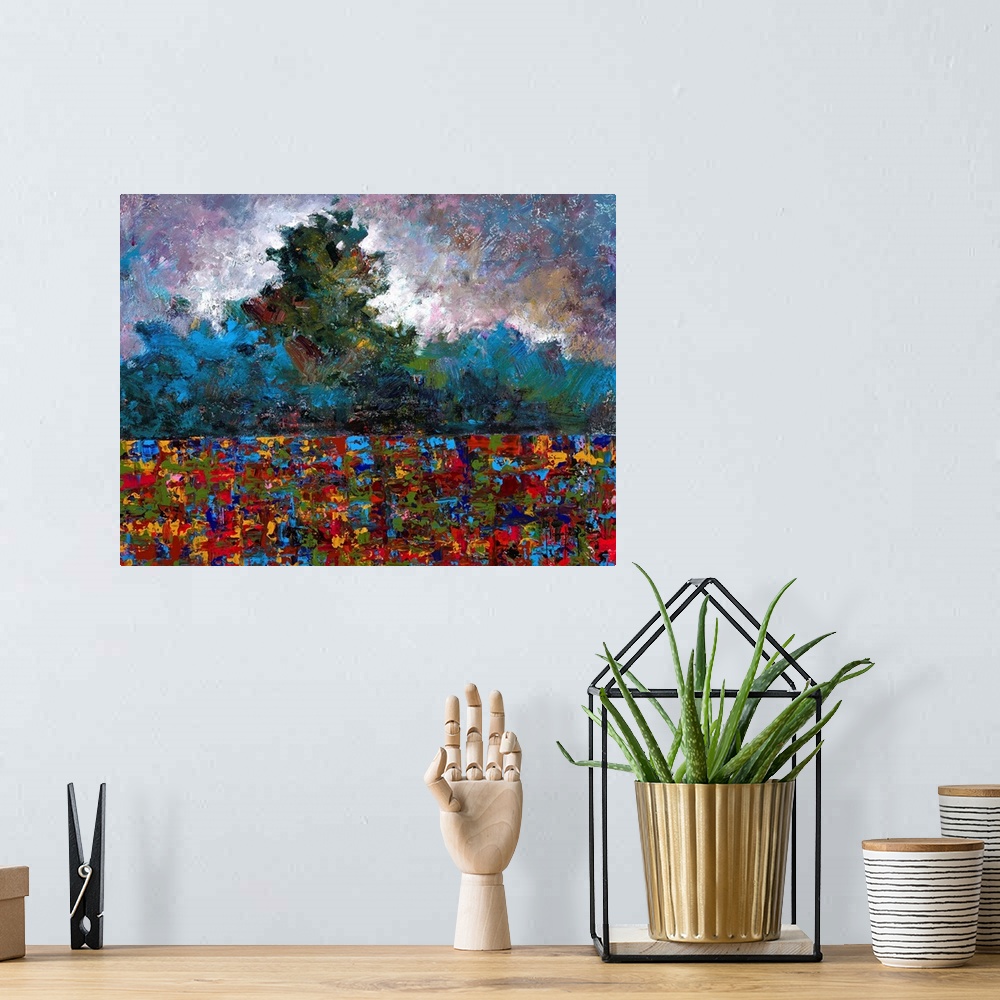 A bohemian room featuring Abstract landscape created with many colors and small, layered brushstrokes.