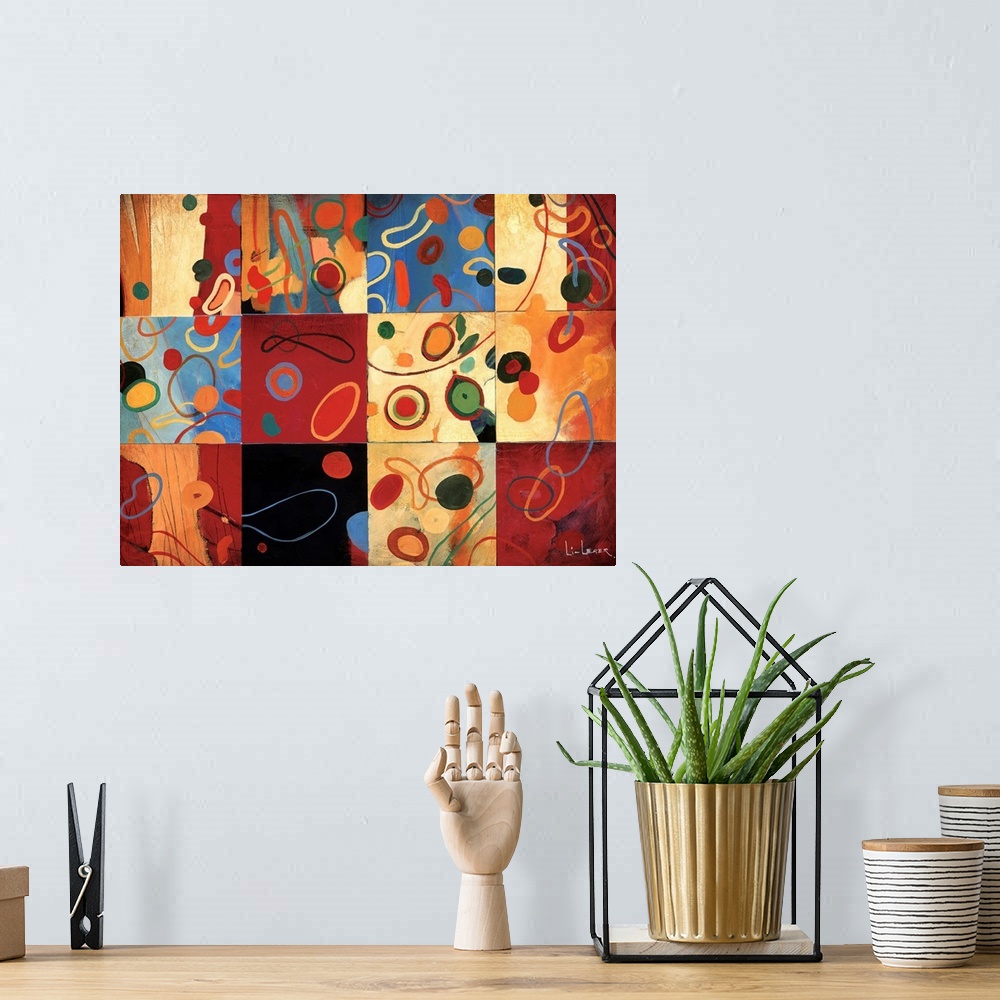 A bohemian room featuring Painting of multi-colored circular shapes on different colored backgrounds in a square grid design.