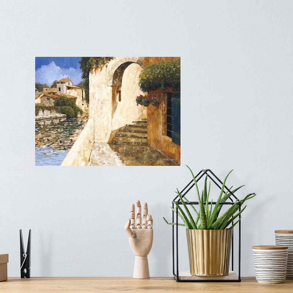 A bohemian room featuring Contemporary painting of an archway in a village near the water.