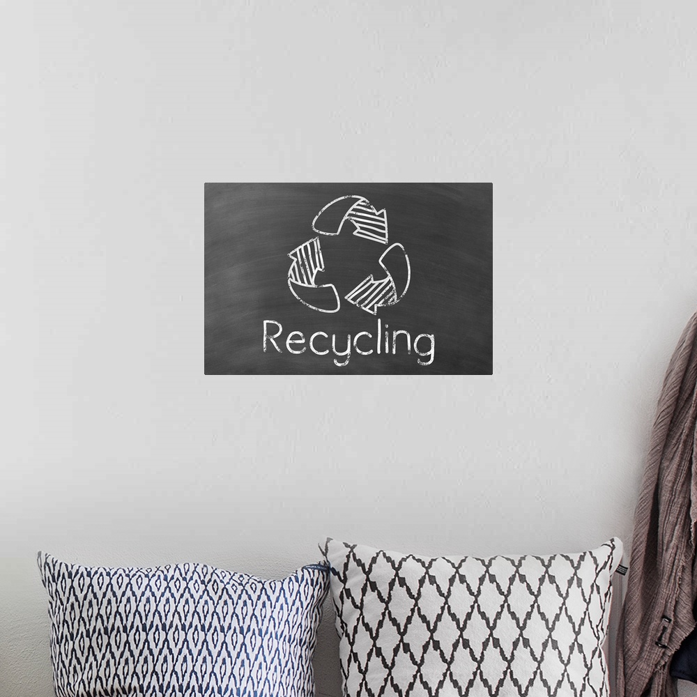 A bohemian room featuring Recycling symbol with "Recycling" written underneath in white on a black chalkboard background.