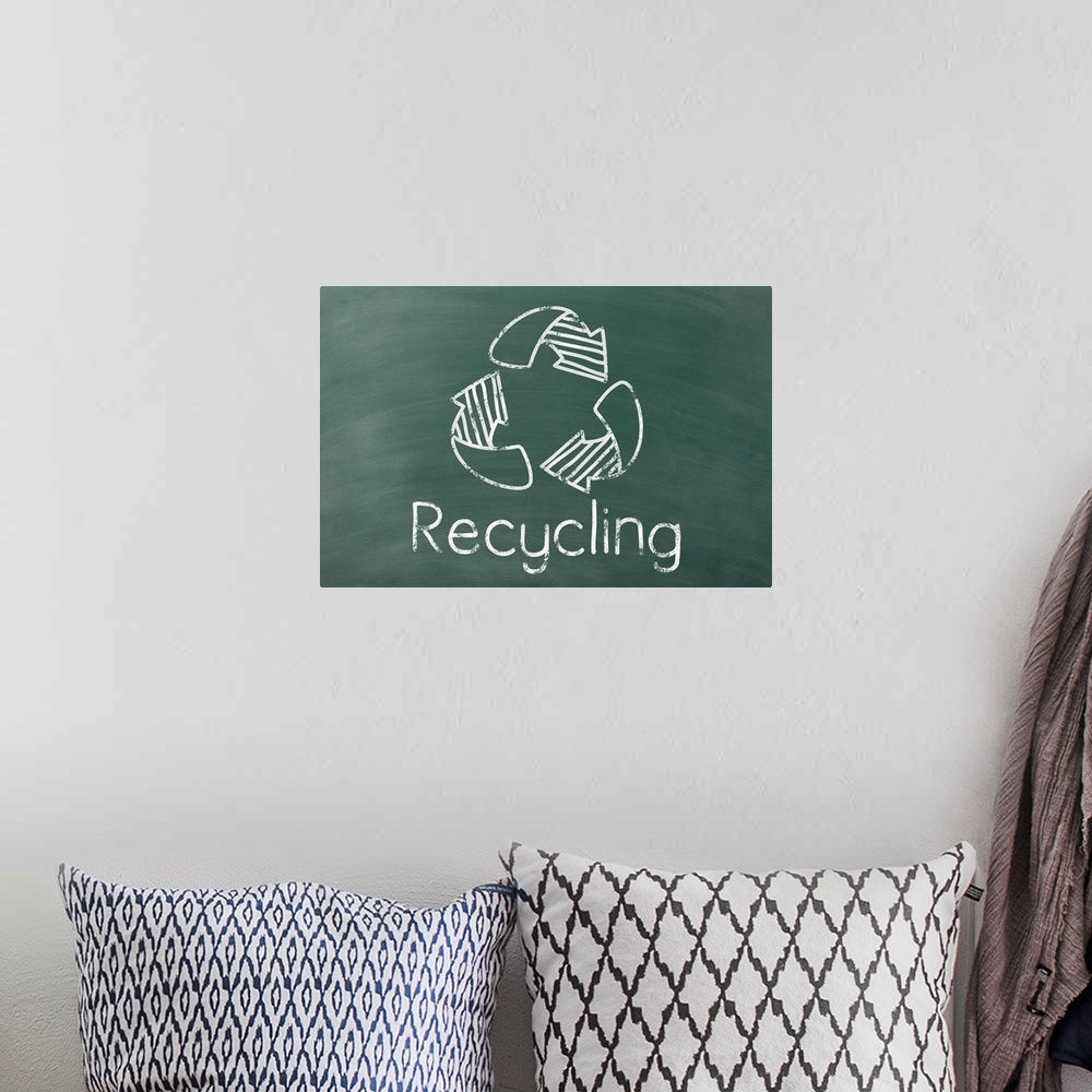 A bohemian room featuring Recycling symbol with "Recycling" written underneath in white on a green chalkboard background.