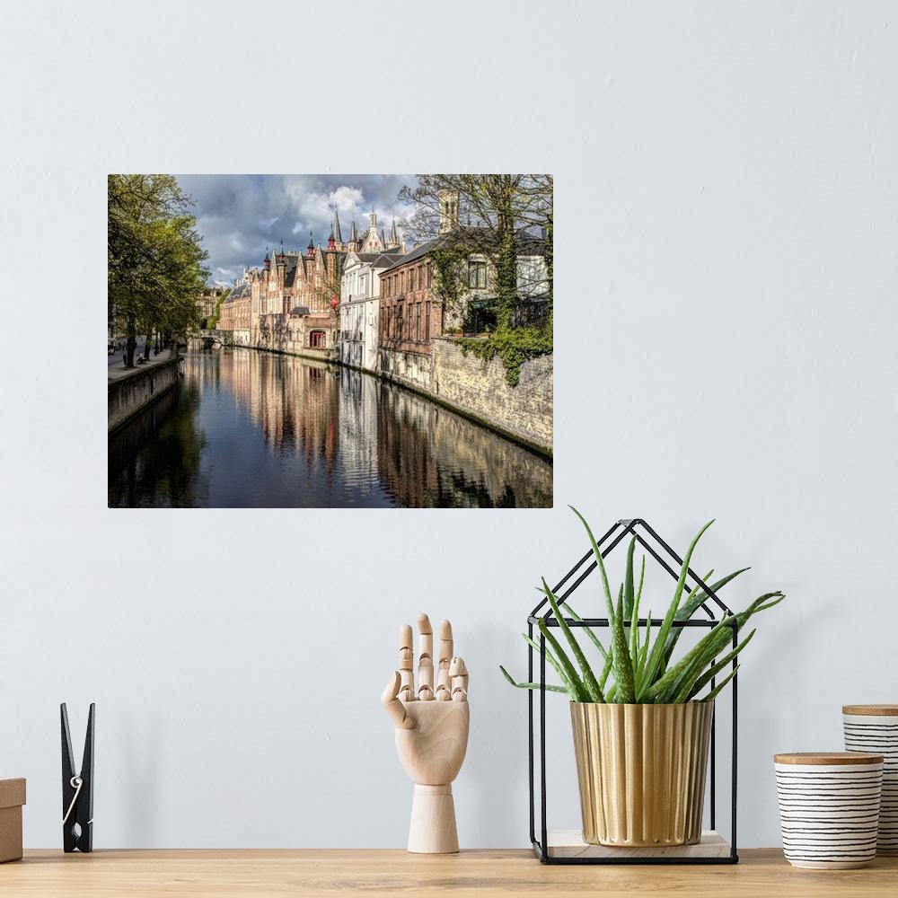 A bohemian room featuring Belgium, Bruges. Reflections of medieval buildings along canal.
