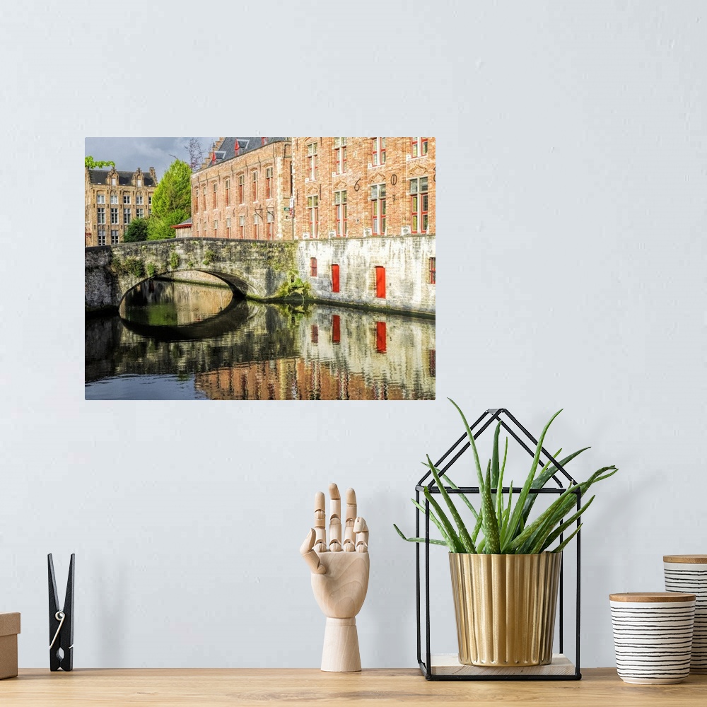 A bohemian room featuring Belgium, Brugge. Reflections of medieval buildings along canal.