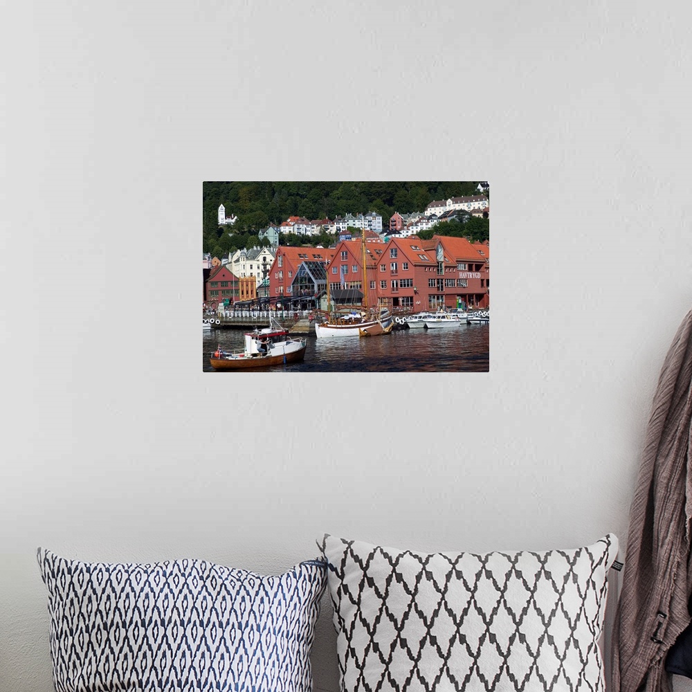 A bohemian room featuring In the back drop of Bryggens ancient buildings  Bergen's harbor offers tours, and mooring for a v...