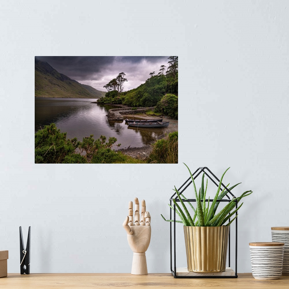 A bohemian room featuring Boats wait for passengers at Doo Lough, part of a national park in County Mayo, Ireland.