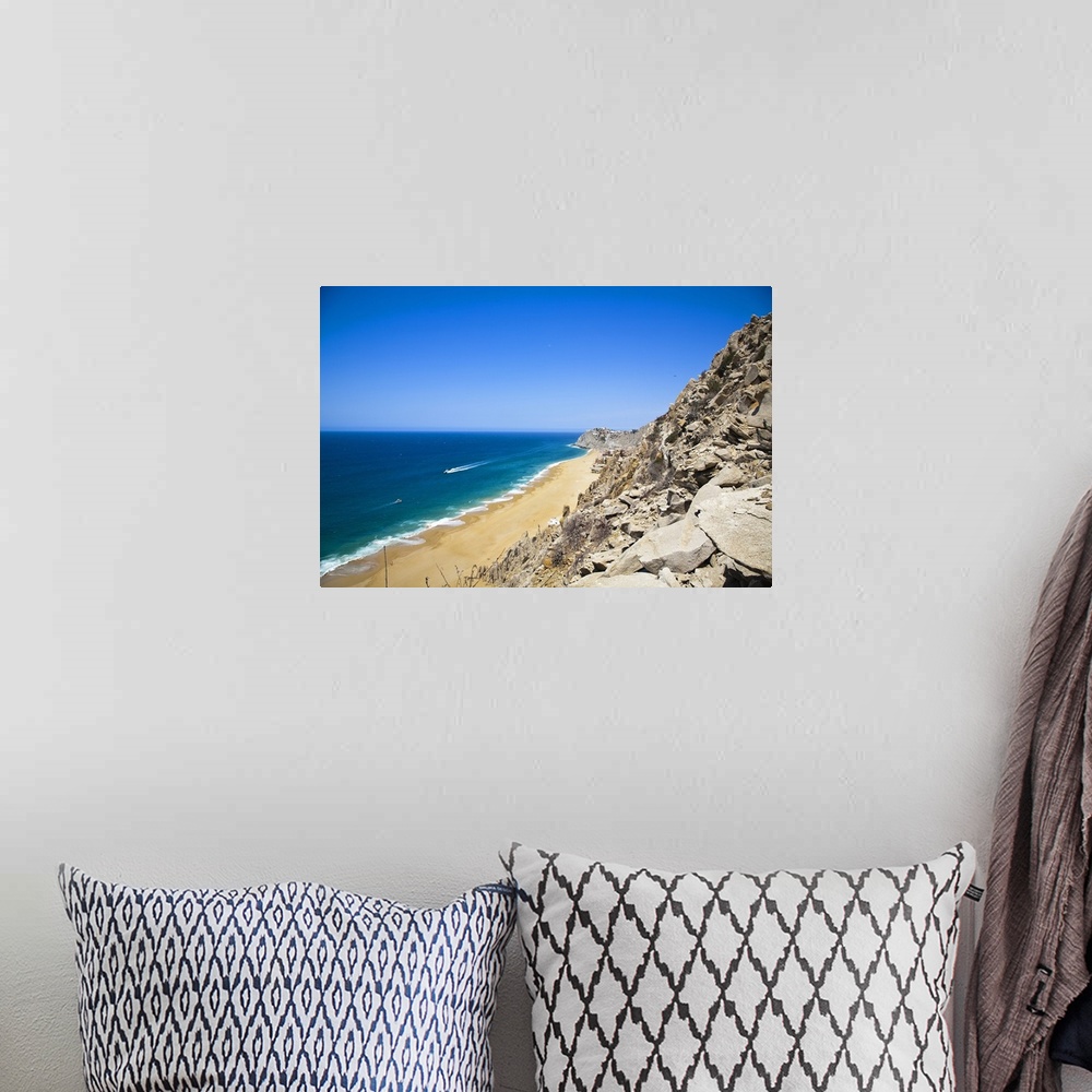 A bohemian room featuring Cabo San Lucas, Baja California Sur, Mexico. A beach with a large rock formation.