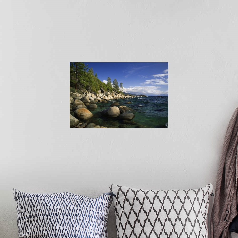 A bohemian room featuring USA, California, Lake Tahoe. Smooth granite boulders line the lake shore in clear water.