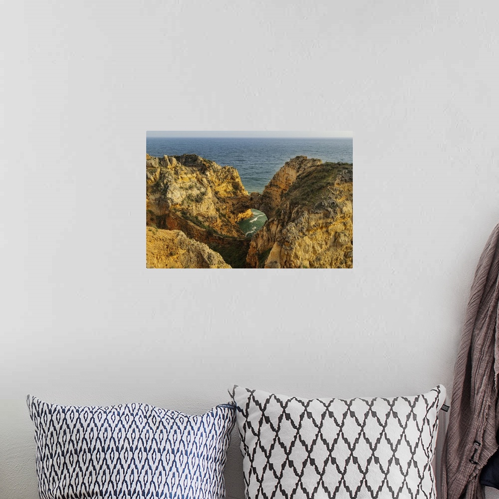 A bohemian room featuring Dramatic Cliffs along the coast at Ponta da Piedade in Lagos, Portugal.