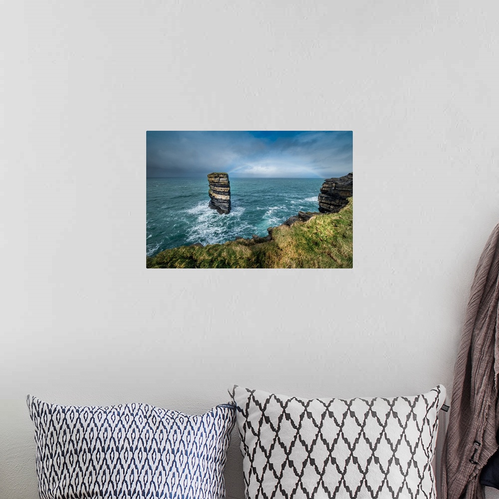 A bohemian room featuring Dun Briste Sea Stack resists the onslaught of the stormy Atlantic Ocean, County Mayo, Ireland.