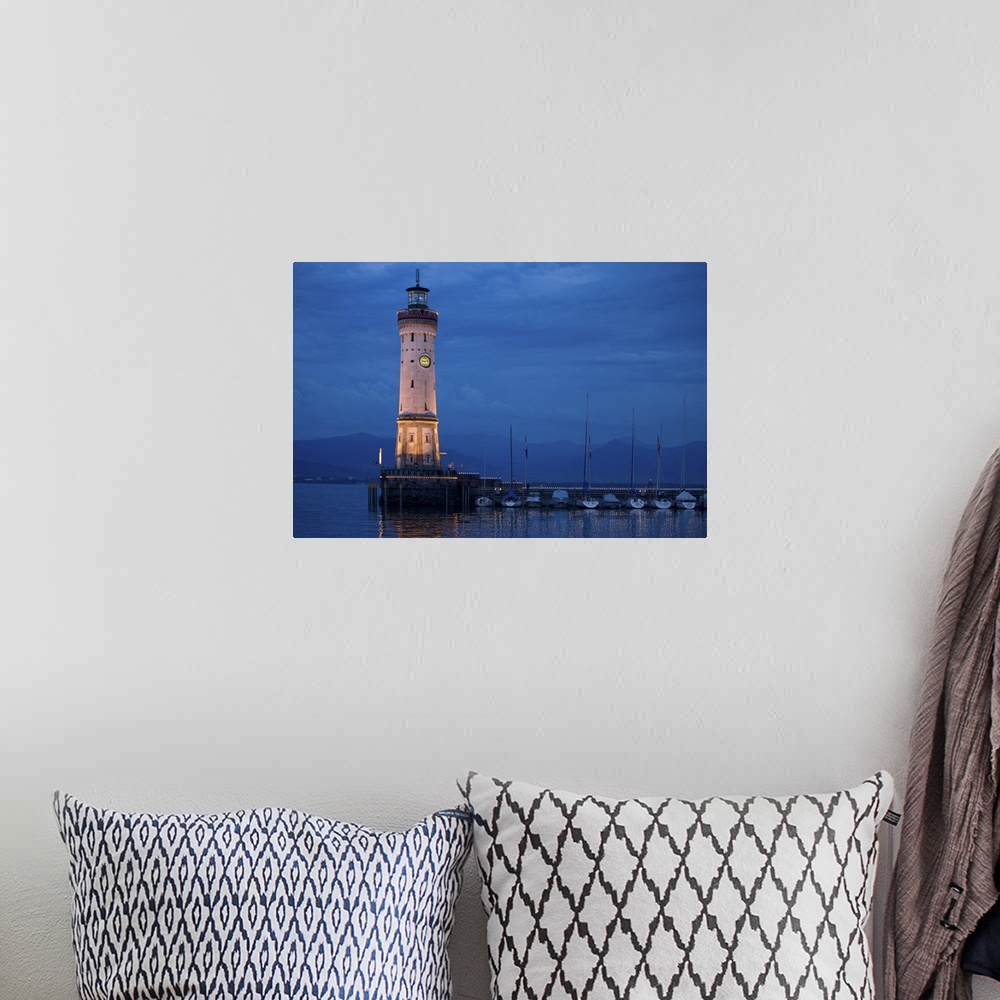 A bohemian room featuring Germany, Lake Constance, View of lighthouse on Lindau Island at sunset