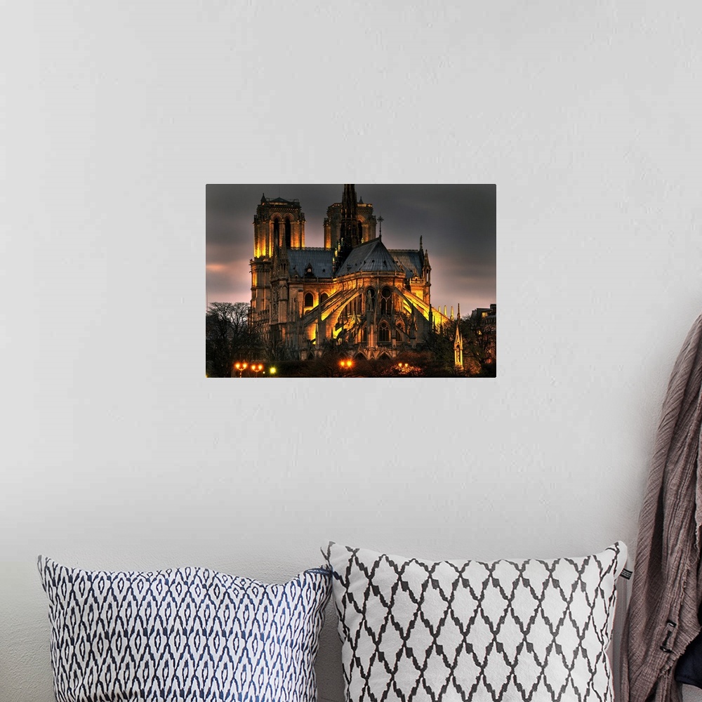 A bohemian room featuring Notre dame cathedral and the seine river shimmer in the Paris, France. Night.