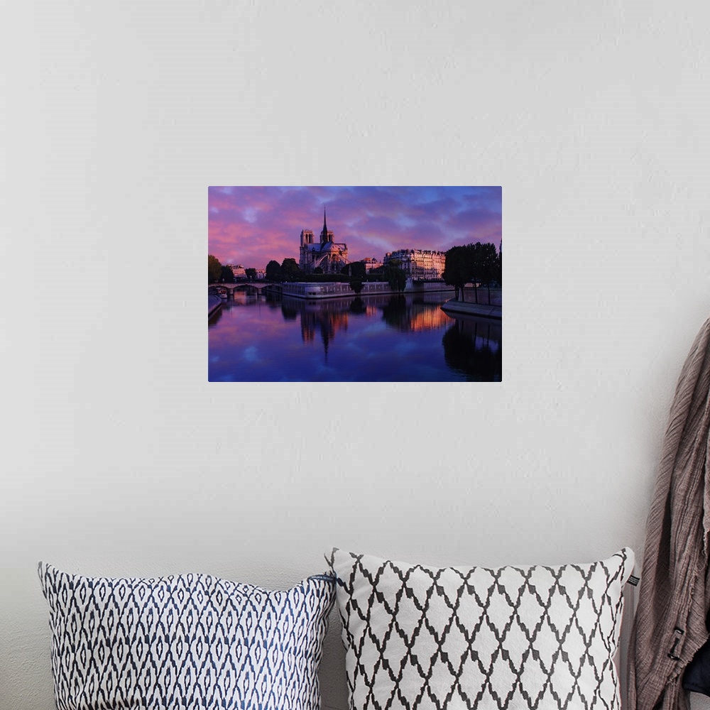 A bohemian room featuring Notre Dame reflected on Seine River at sunrise, Paris, France