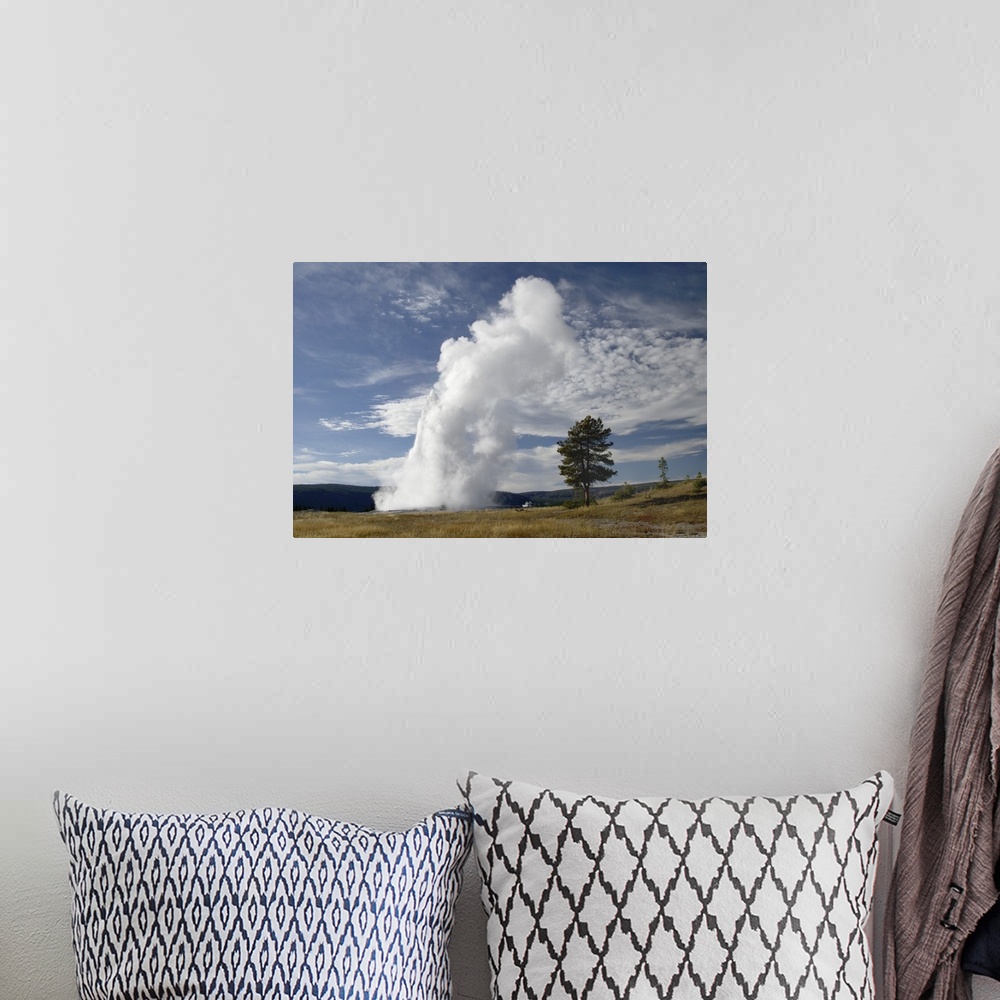 A bohemian room featuring Old Faithful erupting, Yellowstone National Park, Wyoming, September 2005.