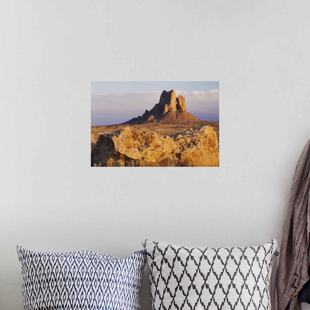 A bohemian room featuring Rocks at sunset, Shiprock, Navajo Indian Reserve, New Mexico, USA, September 2006