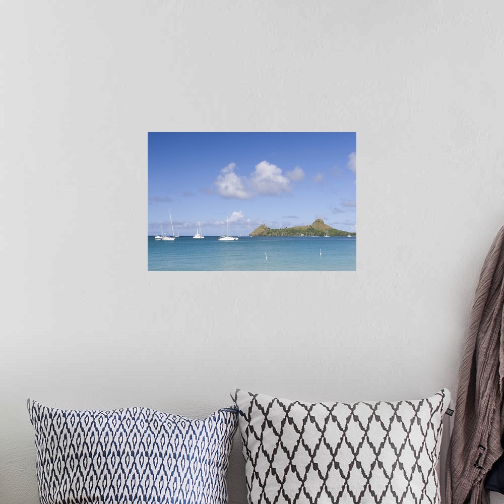 A bohemian room featuring Sailboats anchored off of Reduit beach on the island of St. Lucia in the southern Caribbean.