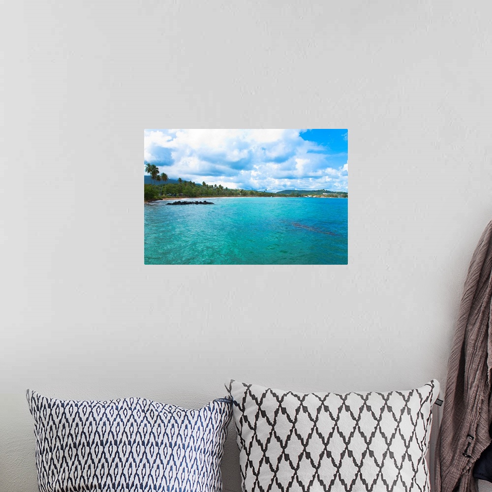 A bohemian room featuring San Juan, Puerto Rico - Calm water is seen in the bay of a tropic island. Trees and beach can be ...