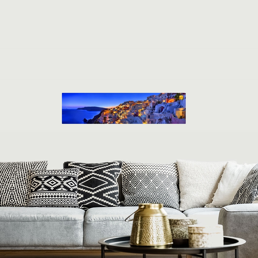 A bohemian room featuring Santorini, Greece on the Mediterranean sea.