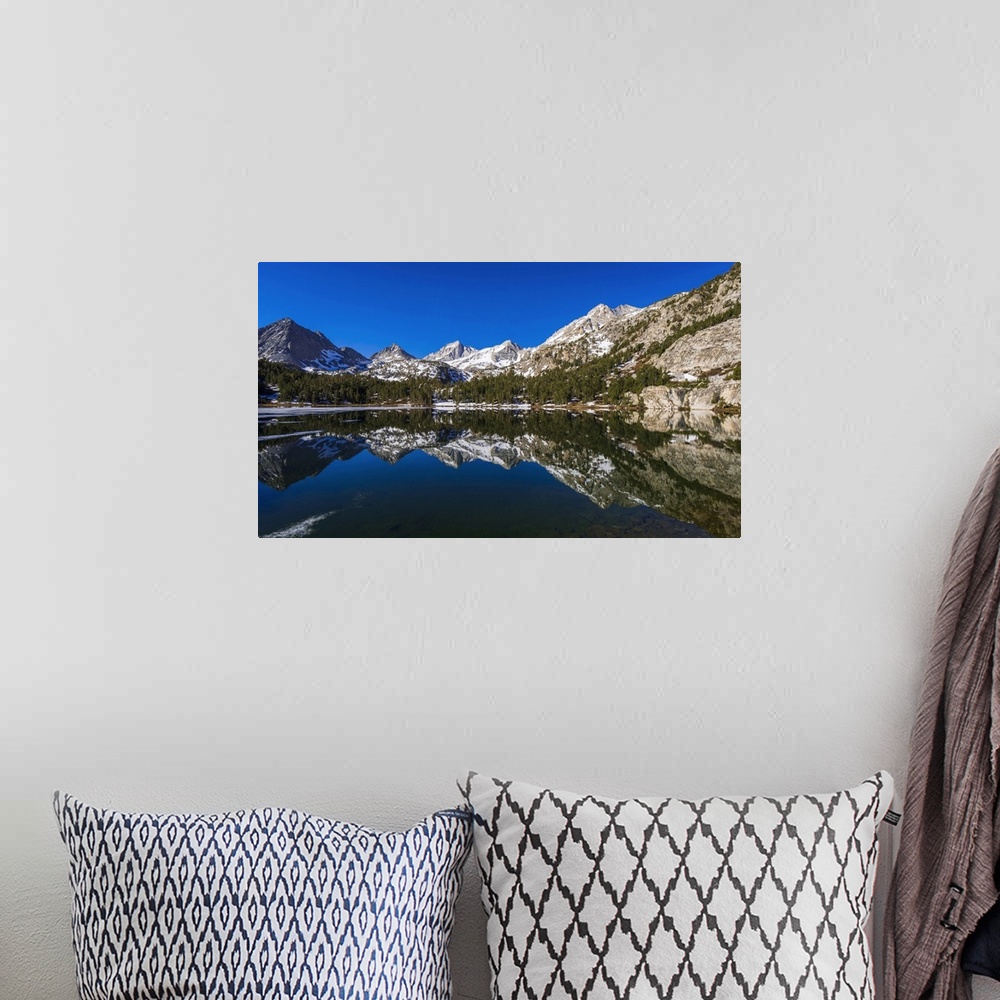 A bohemian room featuring Sierra peaks reflected in Long Lake, Little Lakes Valley, John Muir Wilderness, California, USA.