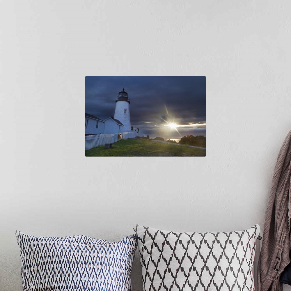 A bohemian room featuring Sun breaks through the clouds at Pemaquid Point Lighthouse in New Harbor, Maine, USA