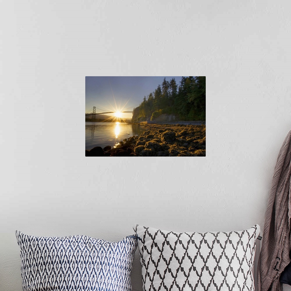 A bohemian room featuring Sun rising behind Lions Gate Bridge, Stanley Park, British Columbia
