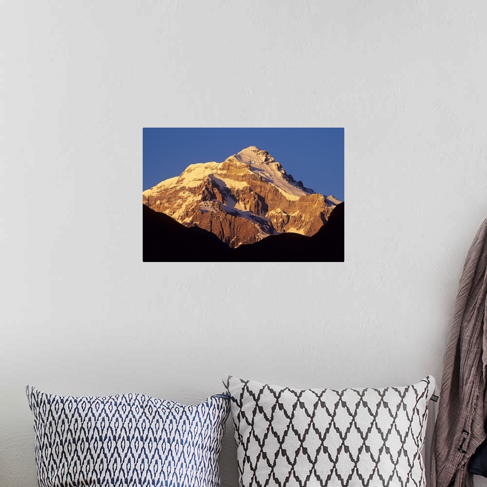 A bohemian room featuring Sunrise on east face of 22,841' Cerro Aconcagua, highest mountain in the Andes, viewed from the V...