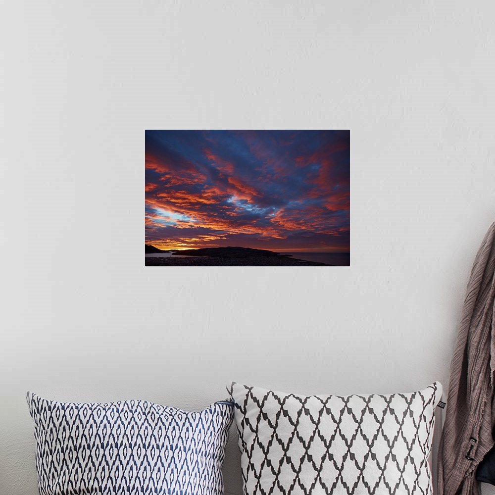A bohemian room featuring Sunrise over Otago harbor and Pacific Ocean, Dunedin, South Island, New Zealand.