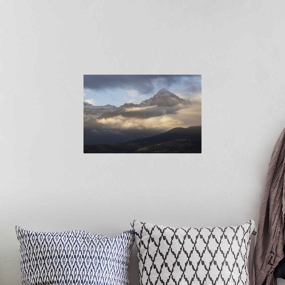 A bohemian room featuring USA, Colorado, Uncompahgre National Forest. Sunrise on clouds below Mount Sneffels. United States...
