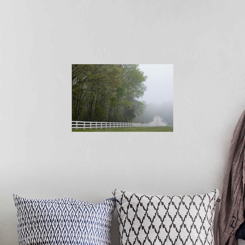 A bohemian room featuring White farmhouse and fence in mist, Powhatan, Virginia, United States.
