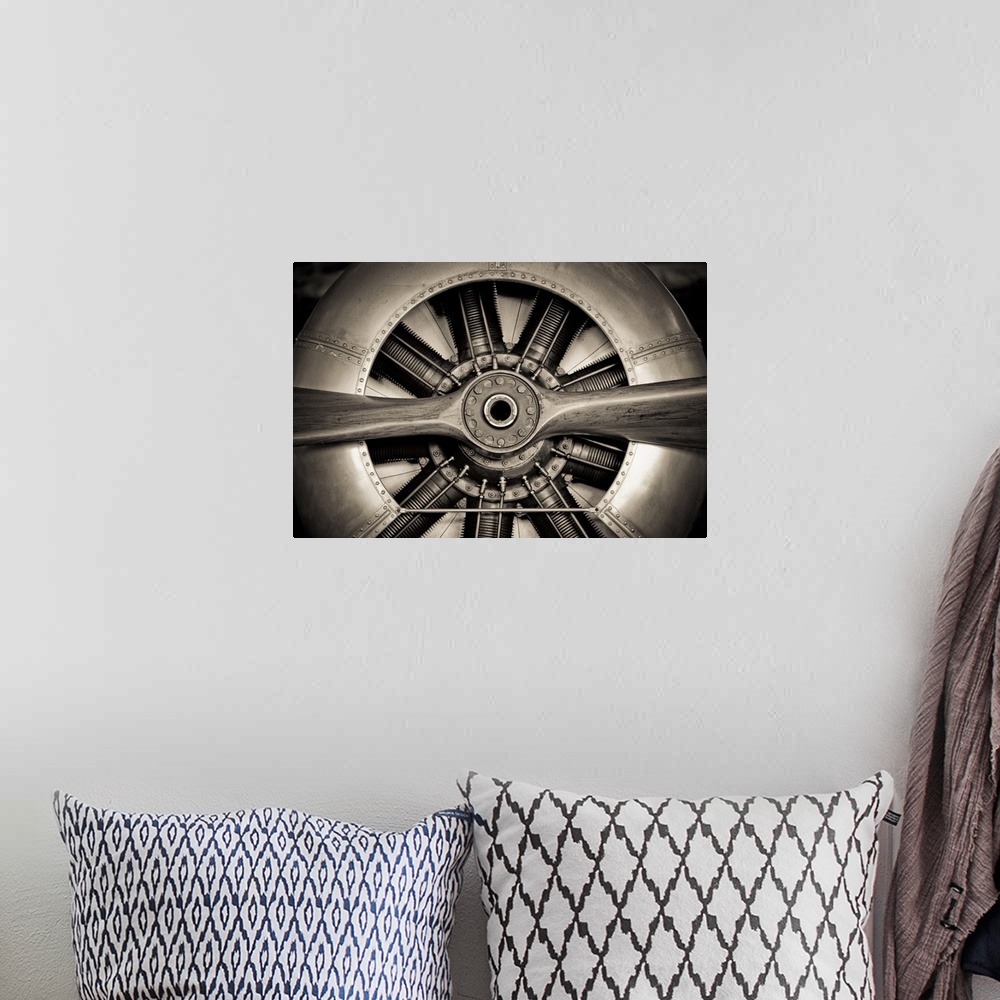 A bohemian room featuring Vintage propeller aircraft engine engineering closeup.