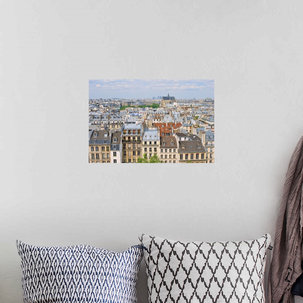 A bohemian room featuring Aerial panorama above houses rooftops in a Paris.
