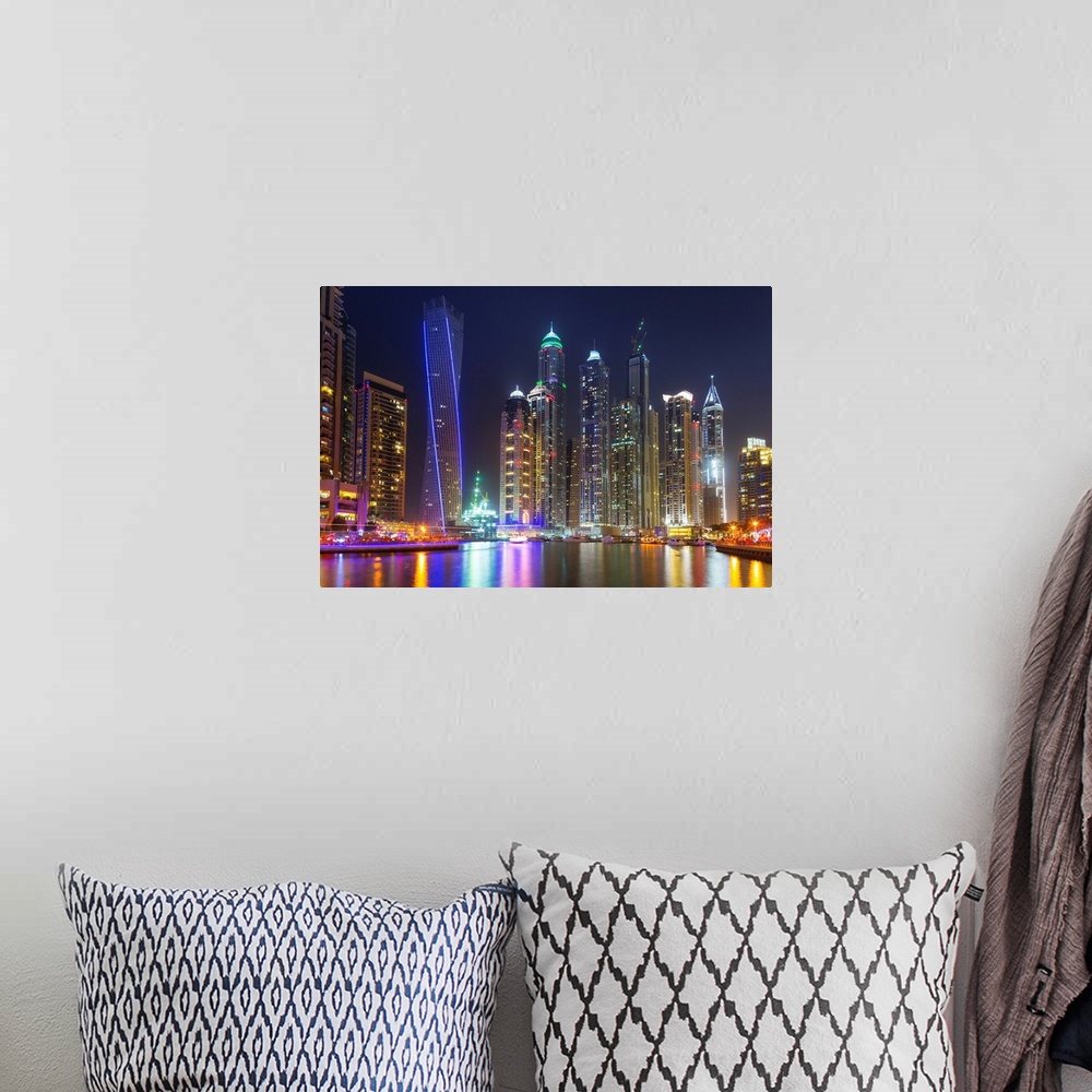 A bohemian room featuring Dubai marina at night in United Arab Emirates.